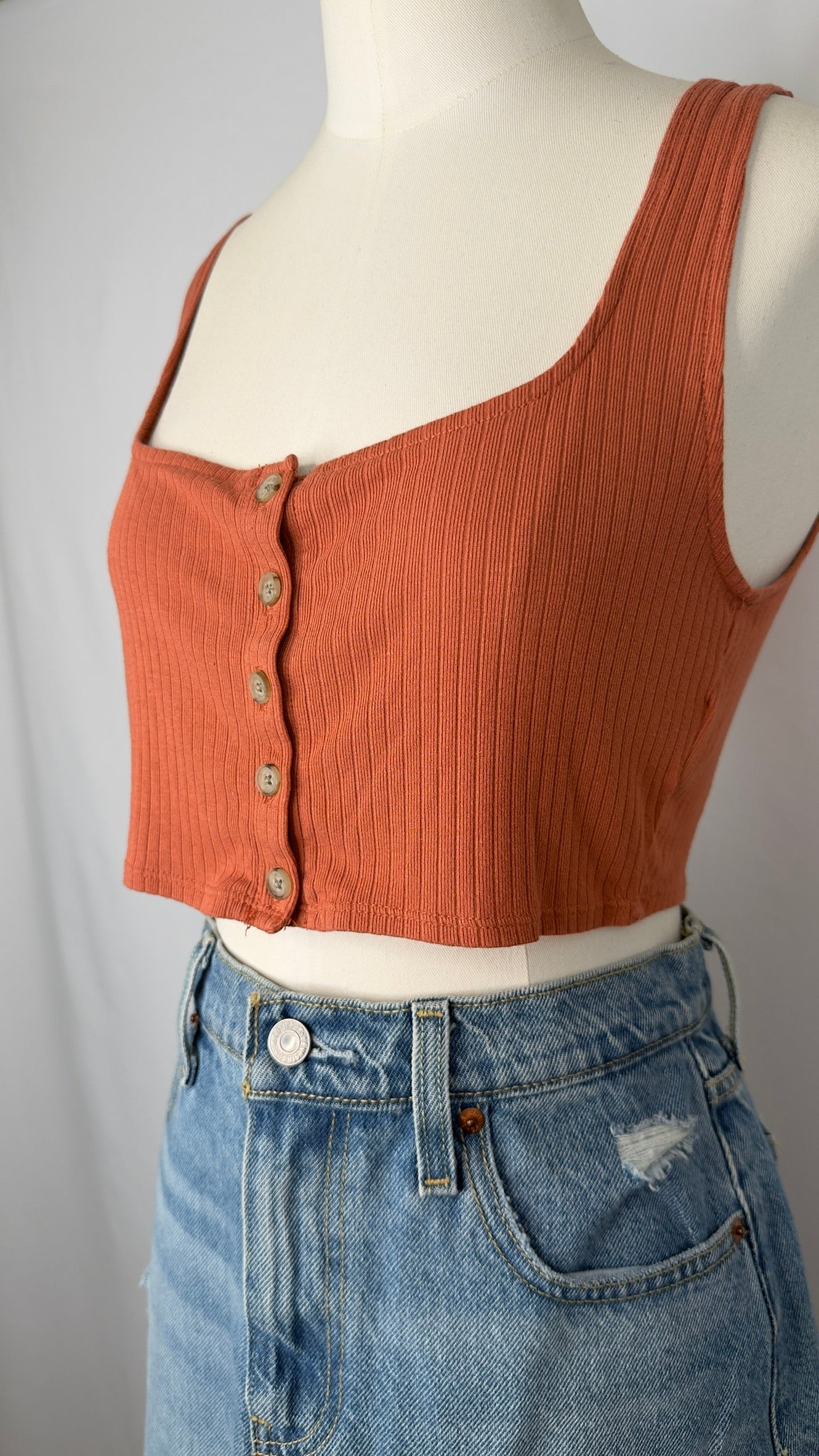 Brown ribbed tank top on a mannequin with a white background.