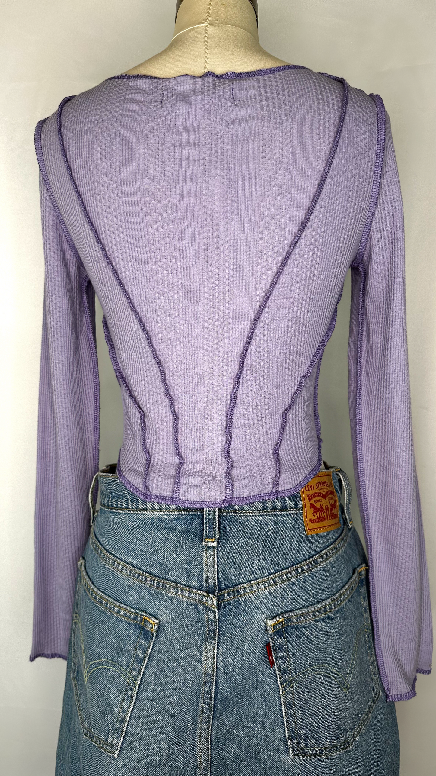 Back view of Urban Outfitters Long Sleeve Corset Style Top in Purple size medium, featuring more corset style stitching.