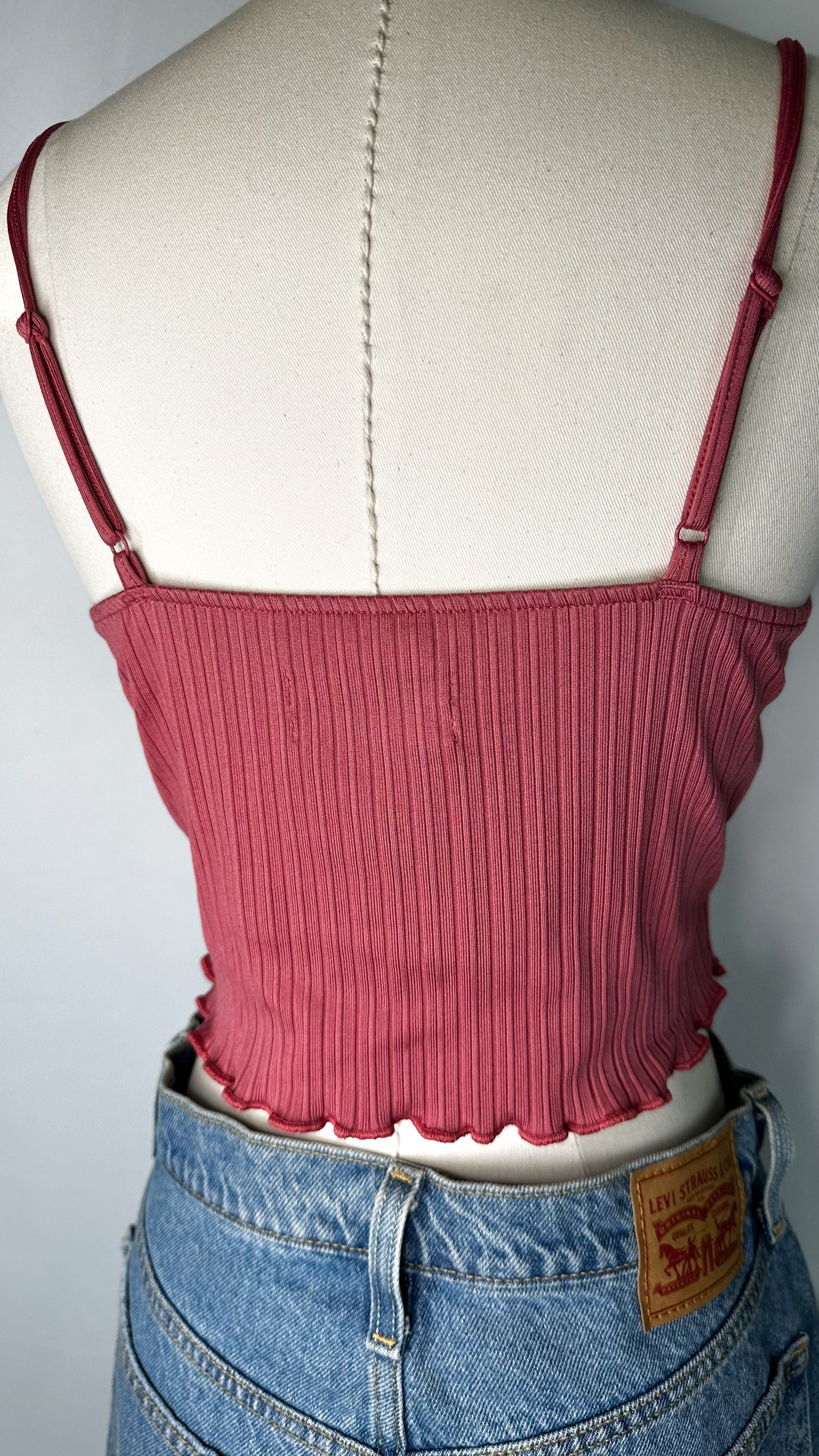 Back view of Urban Outfitters Ribbed Twist Front Cami Top in Pink featuring the adjustable spaghetti straps