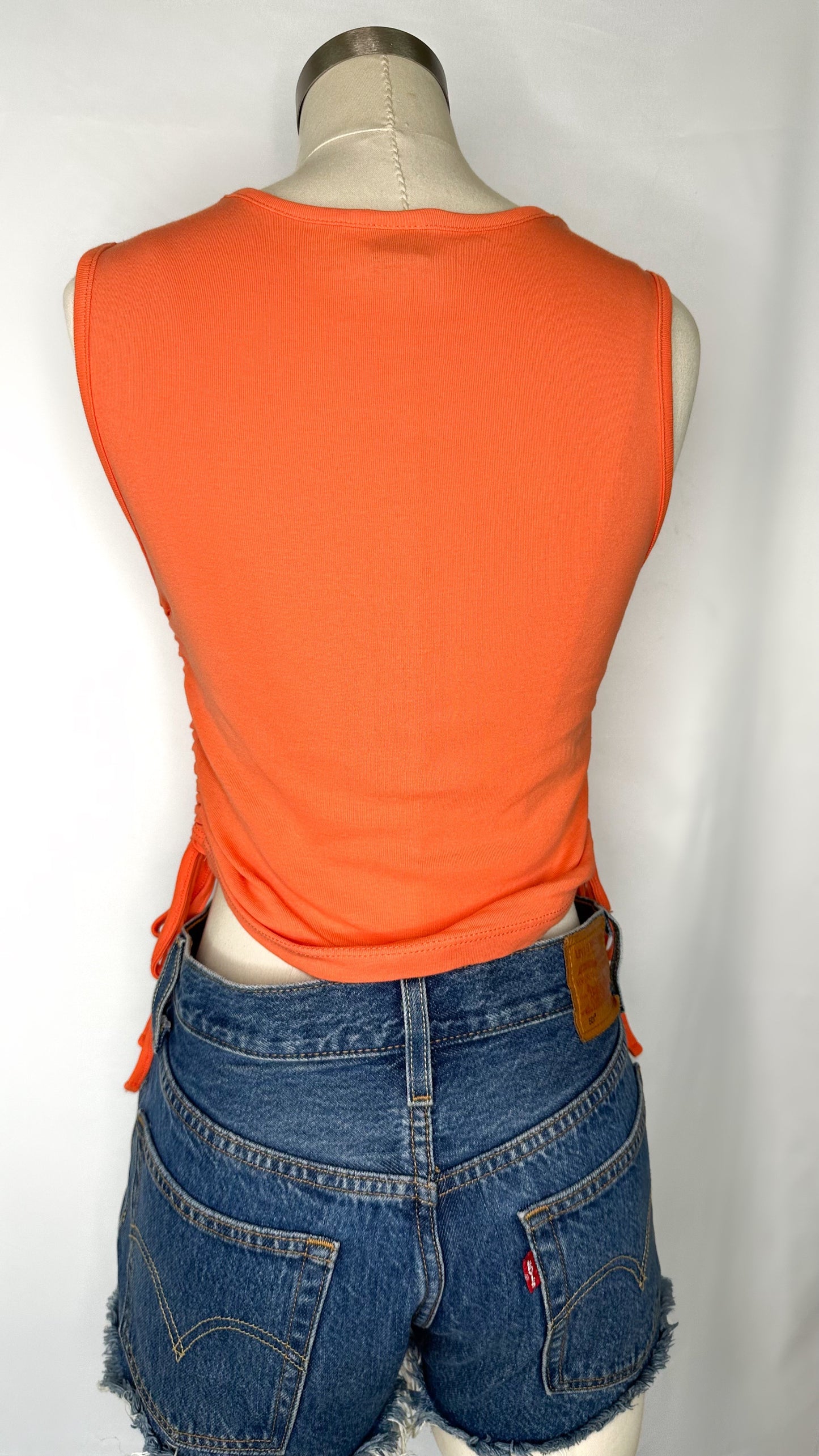 Back shot of Urban Outfitters Turn On Tune In Crop Top in Bright Orange size large.