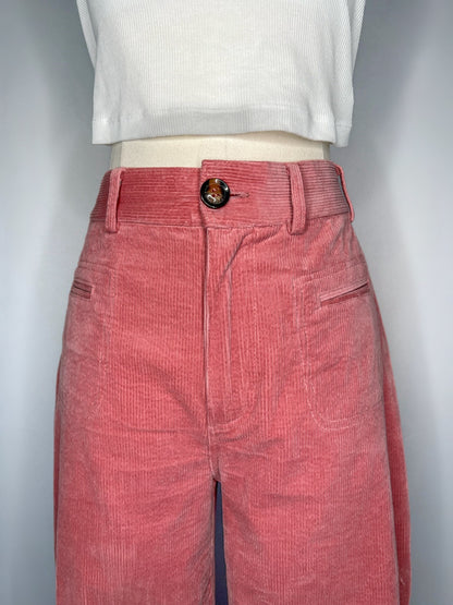 Close up of Saint Geraldine Wide-Leg Corduroy Pant in Pink, featuring the button, belt loops, and two front pockets.