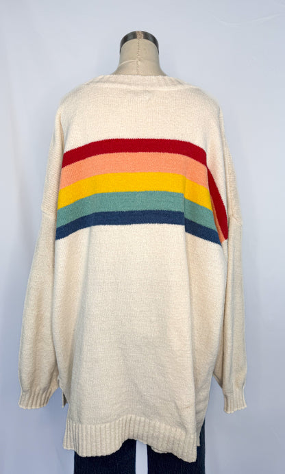 Back side of American Eagle Oversized Rainbow Stripe Sweater in Cream with the stripes continuing from the front.