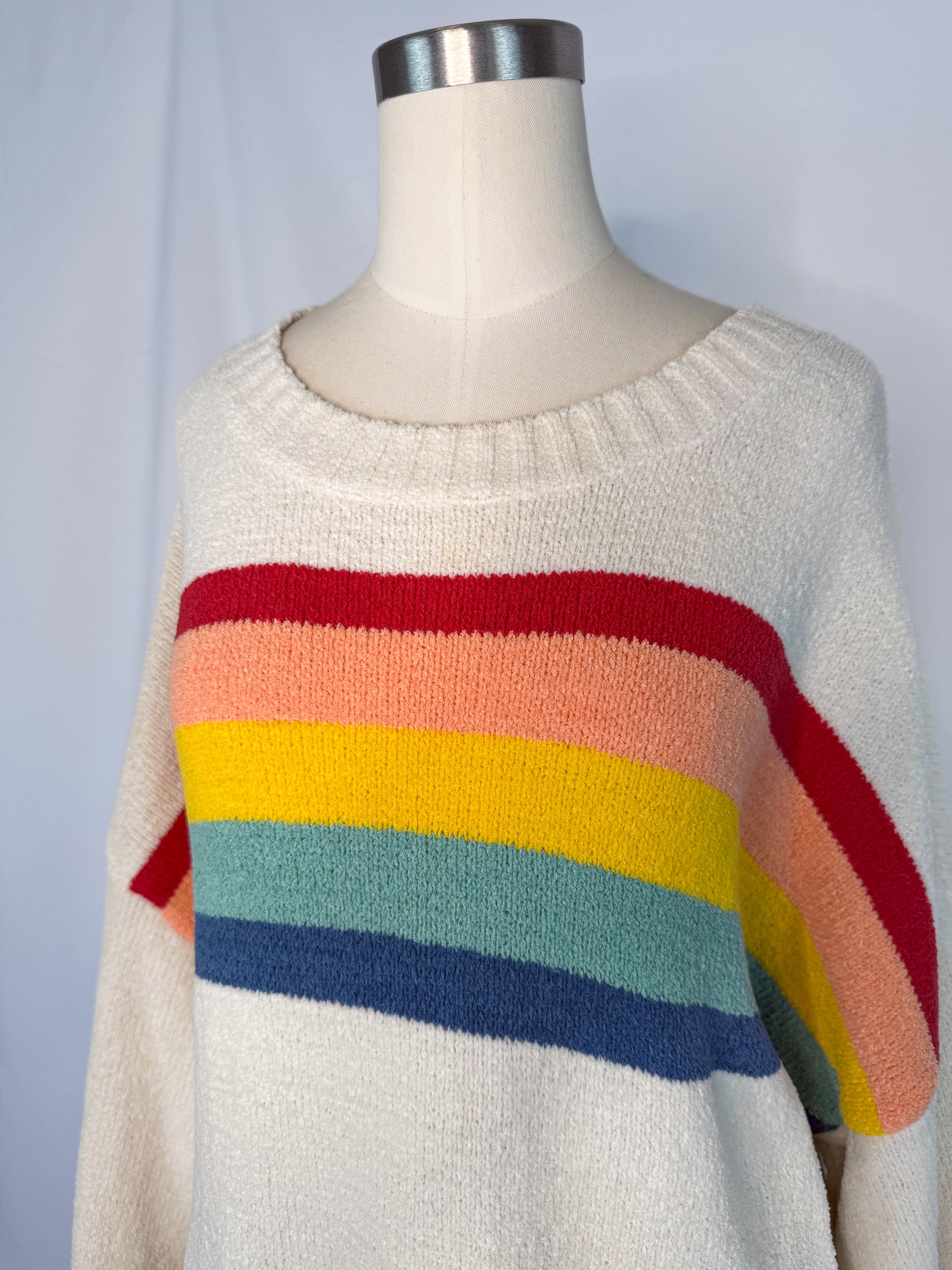 Side view of American Eagle Oversized Rainbow Stripe Sweater in Cream