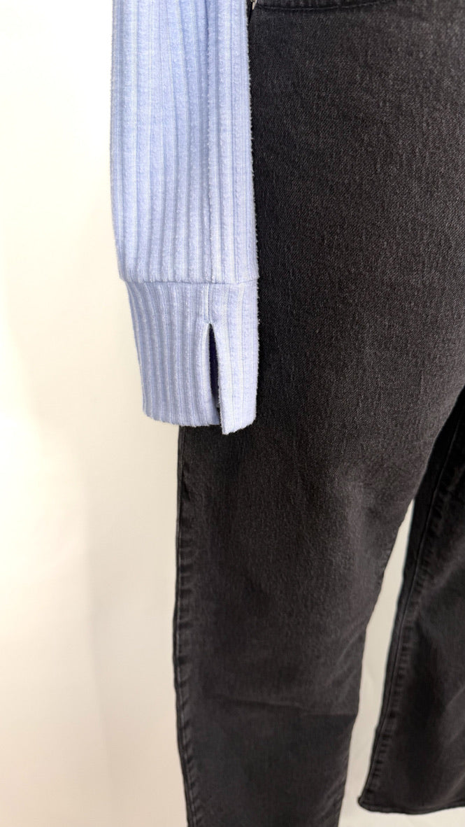 Close-up of the long-sleeve featuring a split wrist opening. 