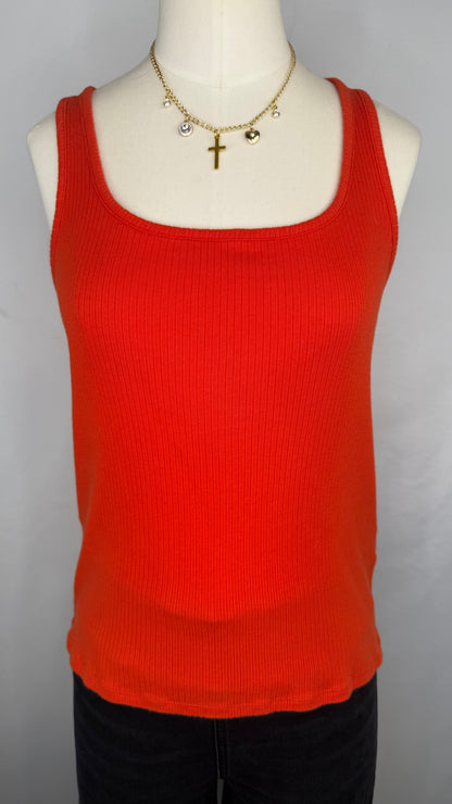 Front view of Madewell Ribbed Square-Neck Tank Top in Flame. The mannequin is shown wearing a gold chain charm necklace and black jeans.