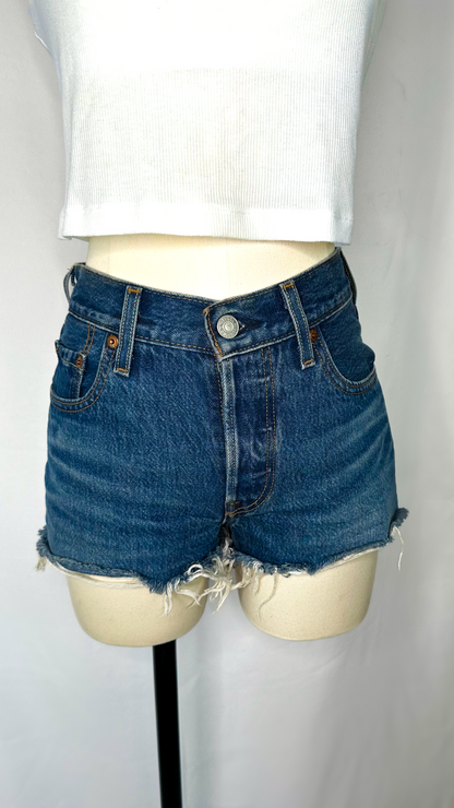 Front shot of Levi's 501 high rise women's shorts in dark wash size 25, featuring a frayed/raw hem and button fly. 