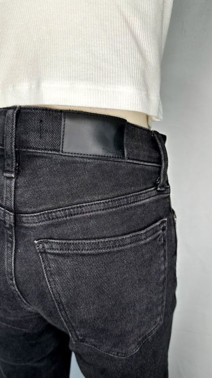 Up-close back view of Madewell Cali Demi-Boot Jeans in Starkey Wash, featuring the black Madewell leather tag and one of the back pockets.