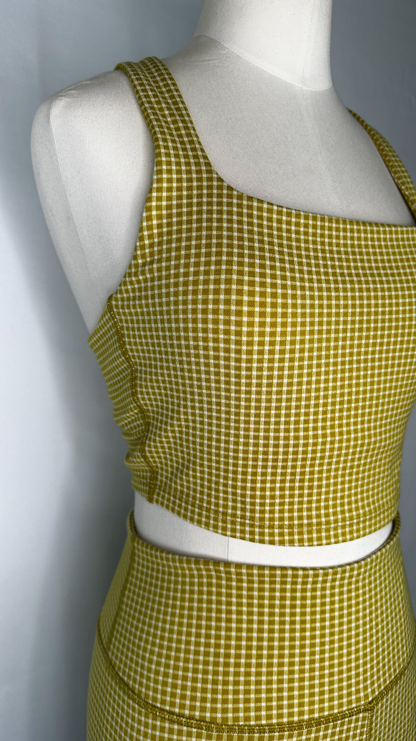 Front side view of Madewell Flex Racerback Crop Tank Top in Gingham print and Citrus Lime color