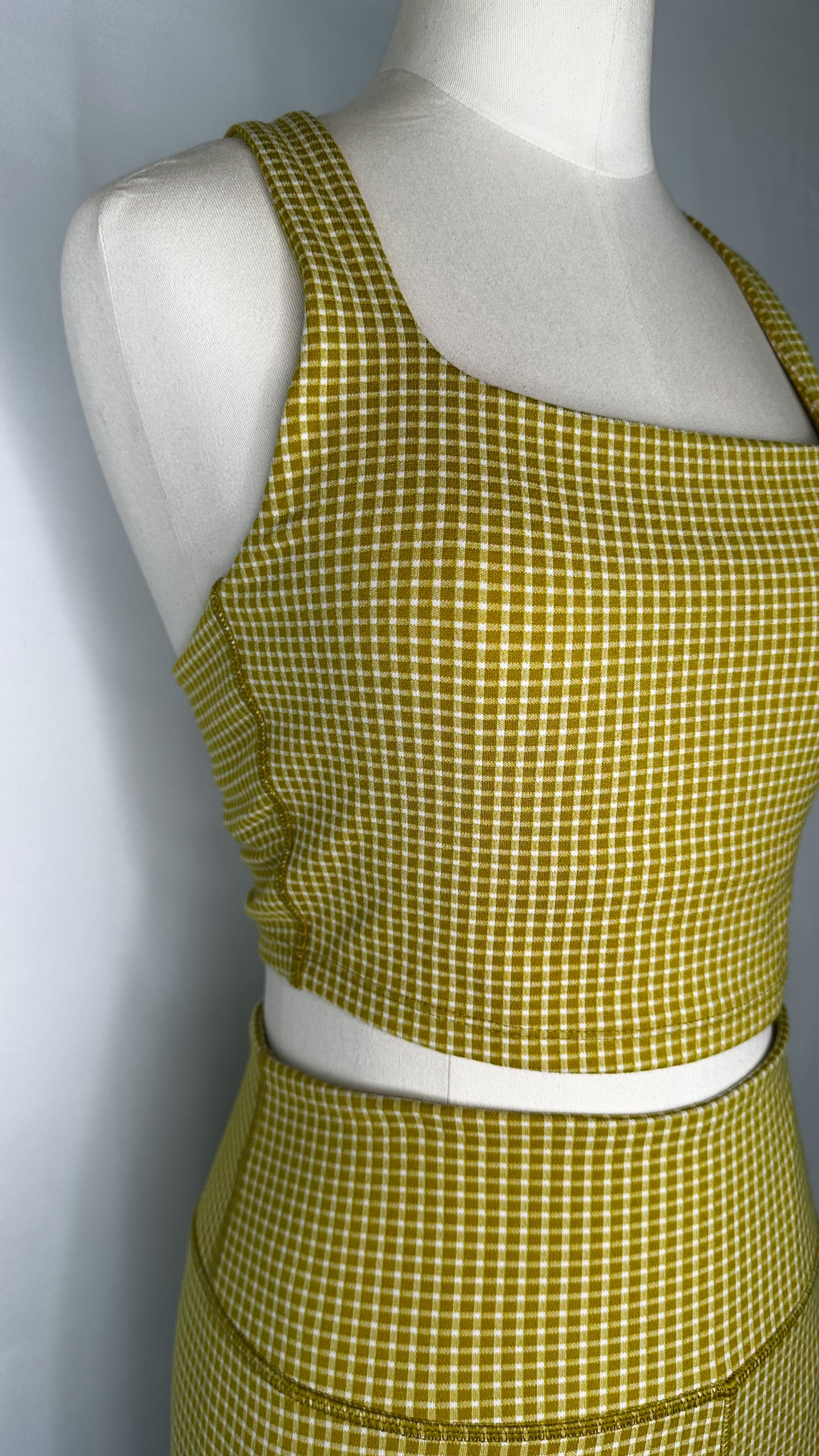 Front side view of Madewell Flex Racerback Crop Tank Top in Gingham print and Citrus Lime color