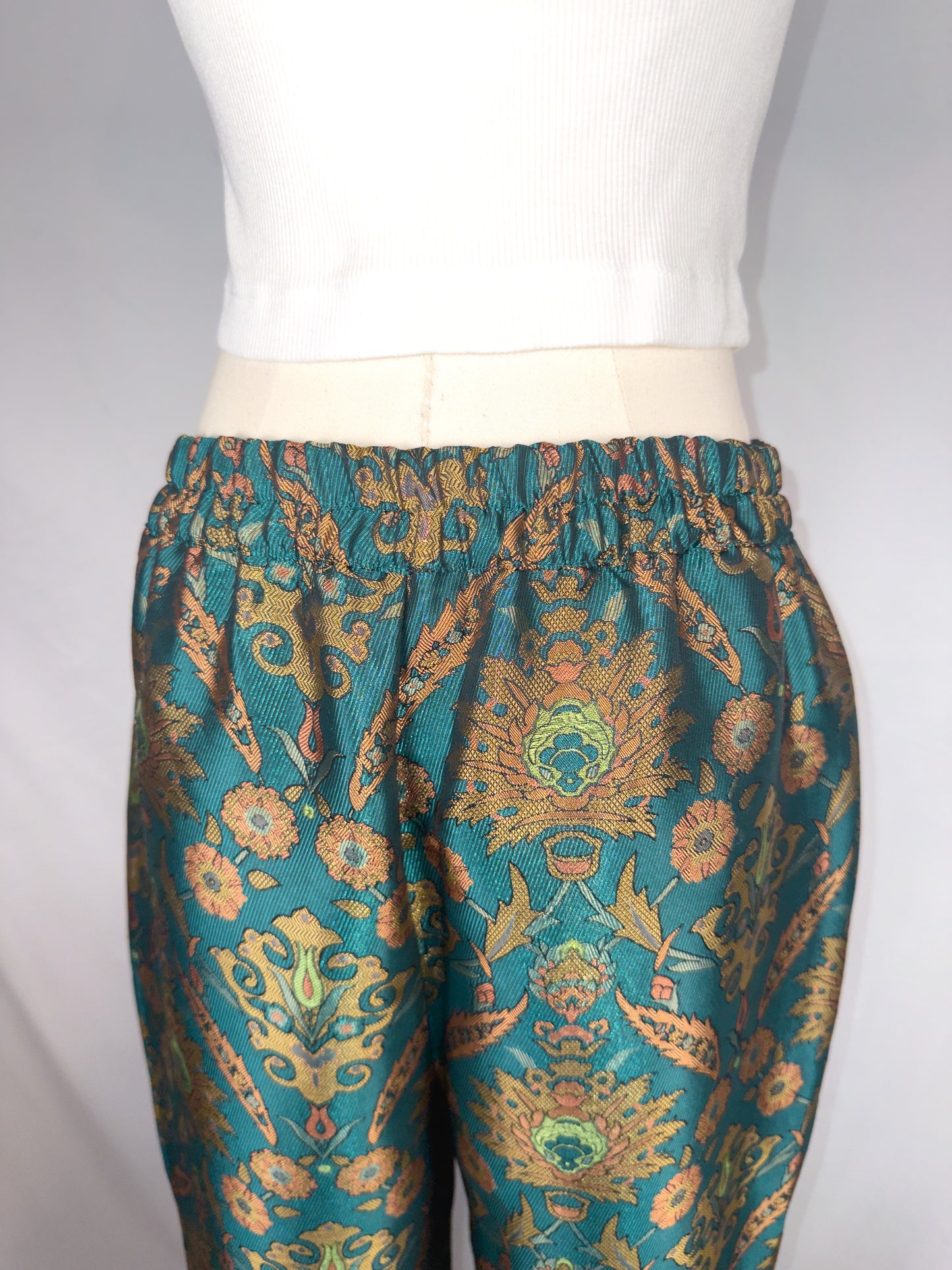 Up-close back view of Maeve by Anthropologie Jacquard Trouser in Multi, featuring the partly elastic waistband.