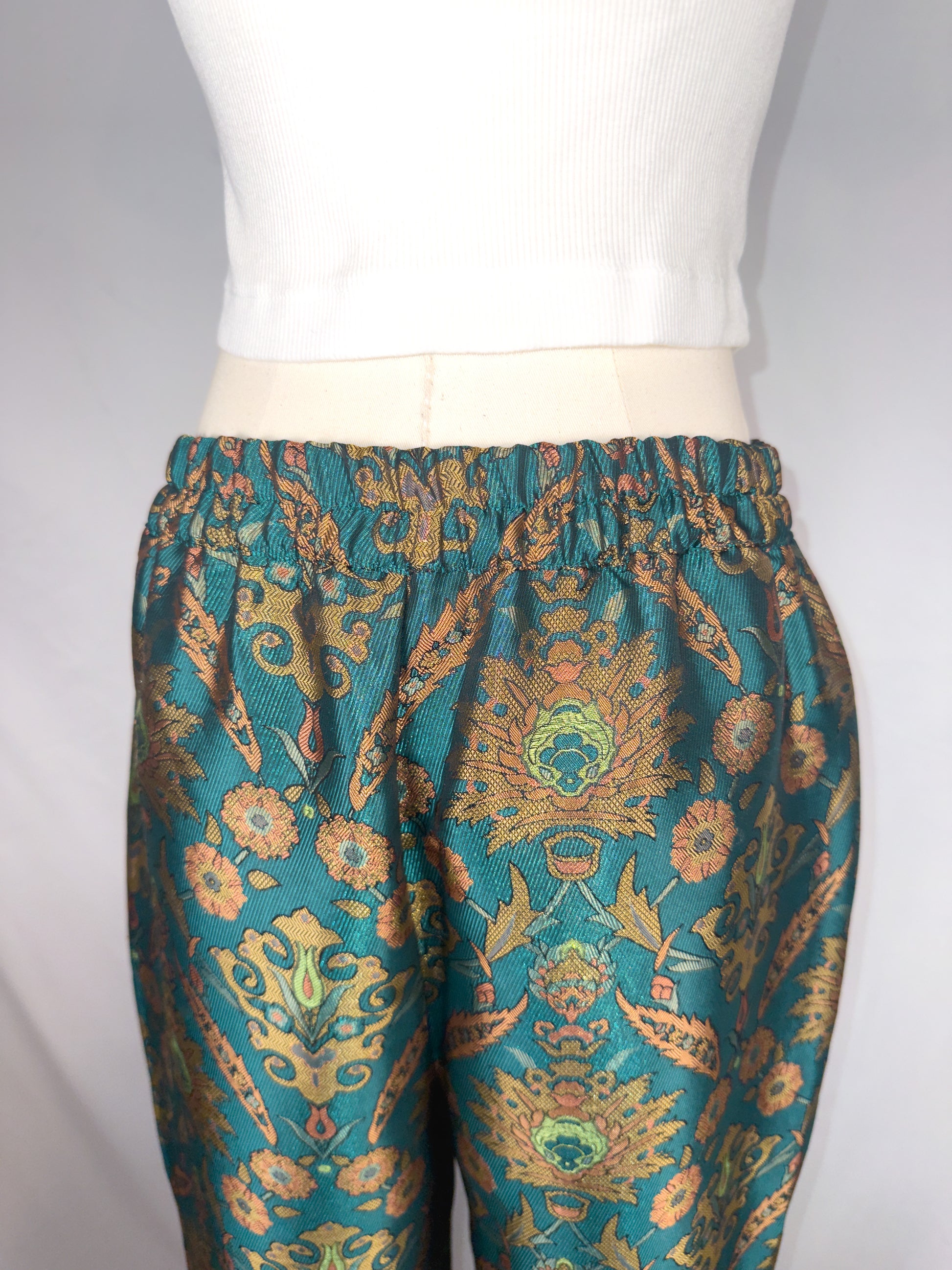 Up-close back view of Maeve by Anthropologie Jacquard Trouser in Multi, featuring the partly elastic waistband.