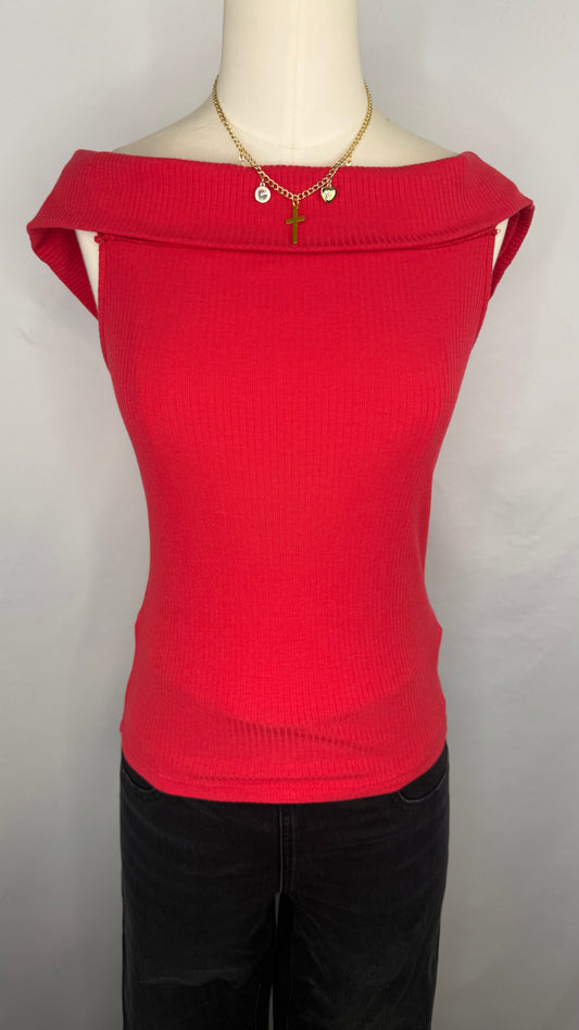 A red, off-shoulder ribbed top displayed on a mannequin with black pants and a necklace.