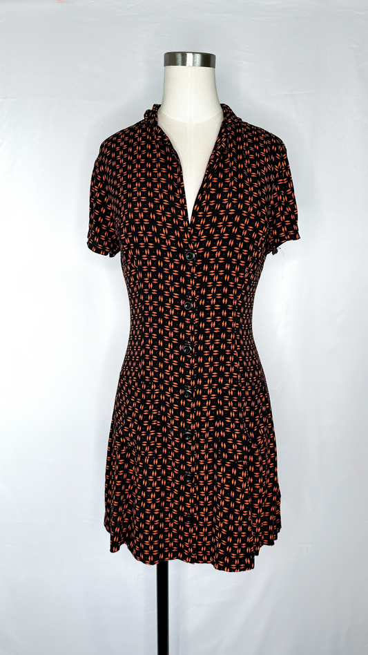 Front view of Silence + Noise Button-Down Mini Dress in Retro Print size medium, featuring two pockets and buttons going all the way down the dress.