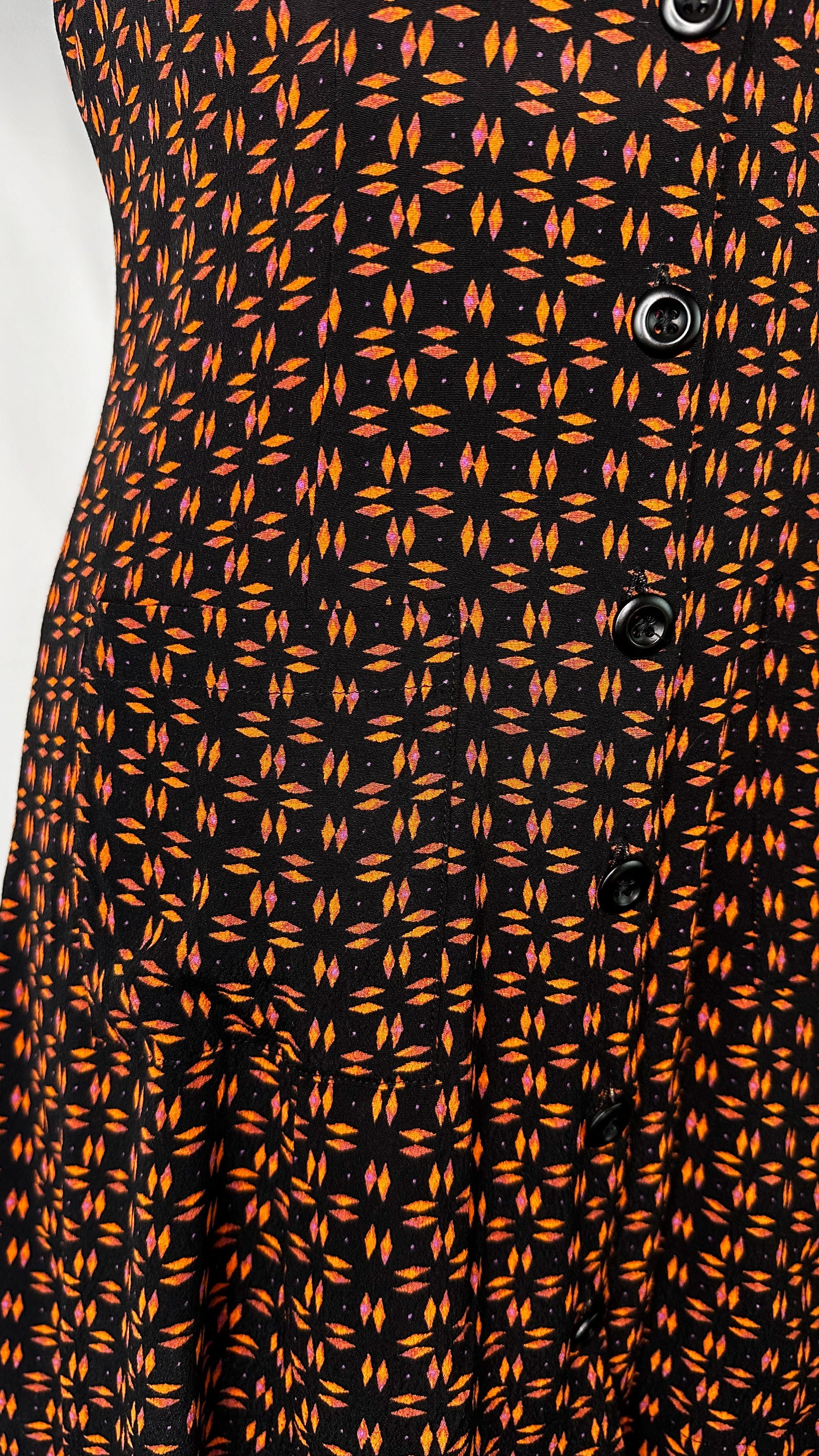 Up-Close front view of Silence + Noise Button-Down Mini Dress in Retro Print, featuring one of the pockets and a few buttons.