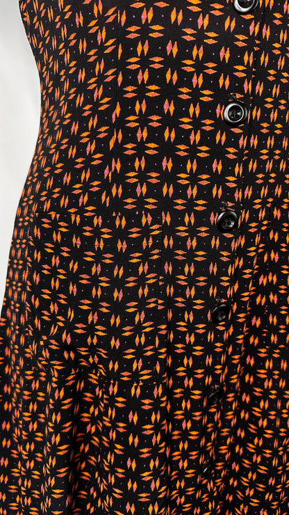 Up-Close front view of Silence + Noise Button-Down Mini Dress in Retro Print, featuring one of the pockets and a few buttons.