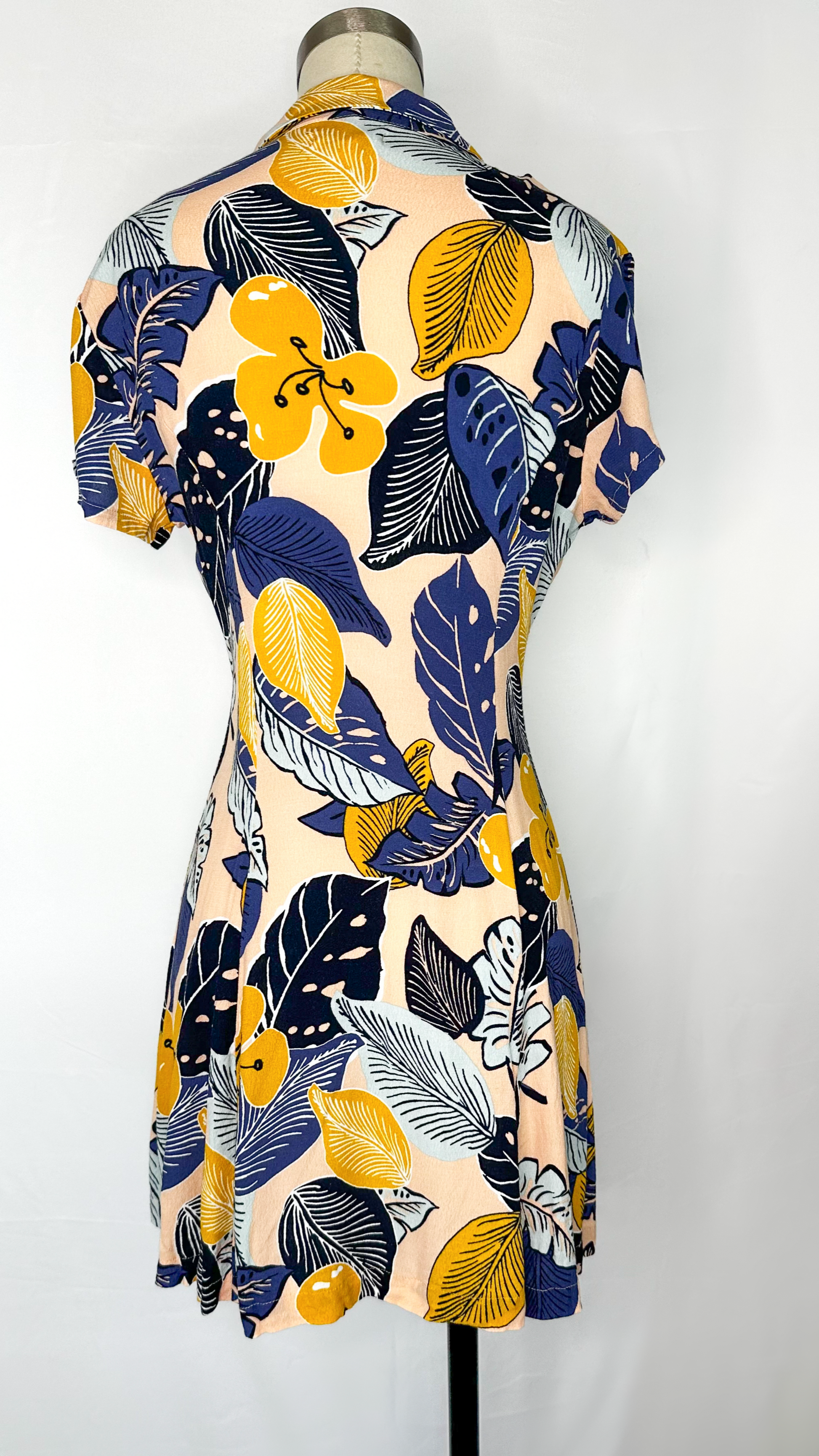 Back view of Silence + Noise Button-Down Mini Dress in Tropical Print.