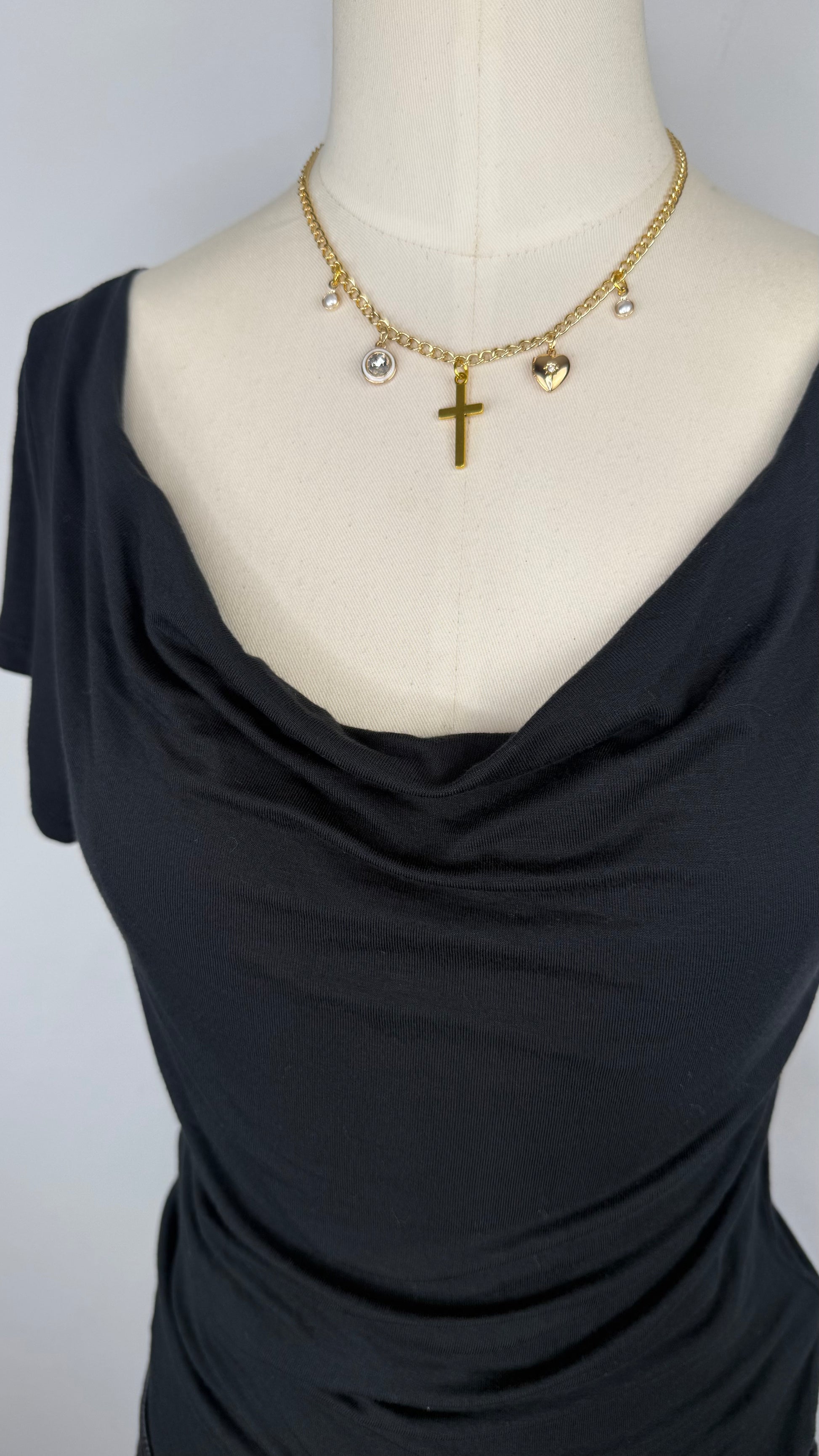 Up-close front view of Silence + Noise Cowl Neck Top in Black featuring the cowl neckline.