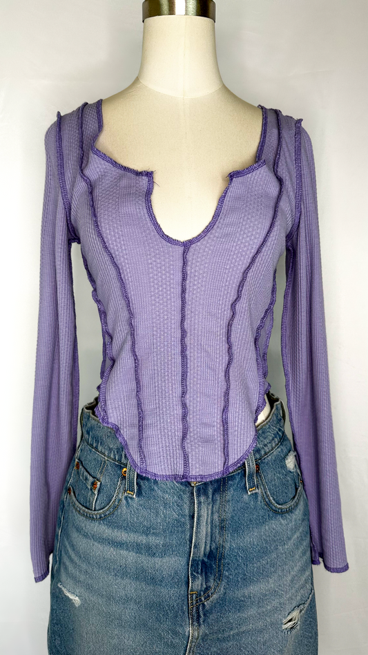 Front facing view of Urban Outfitters Long Sleeve Corset Style Top in Purple size medium. Featuring a v-neck, corset style stitching, and a scoop bottom hem.
