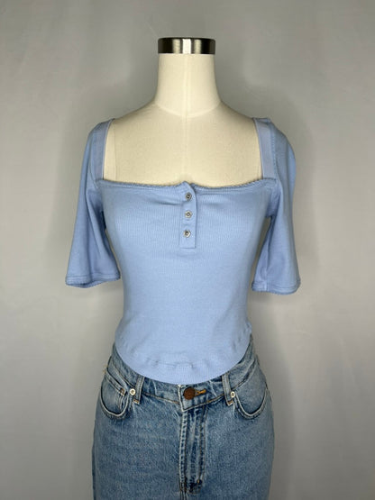Front view of Urban Outfitters Square Neck Crop Top in Light Blue shown on a mannequin wearing light blue jeans.