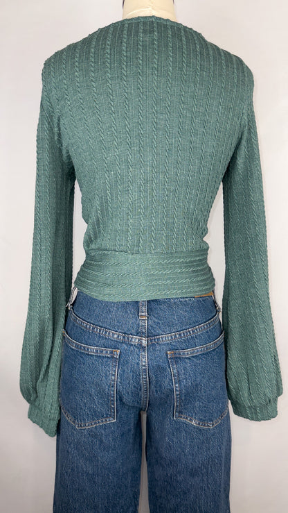 Back view of ZAFUL Ribbed Knit Cropped Wrap Top in Green. The top is paired with a dark blue jean. The cuff belle sleeves are also shown. 