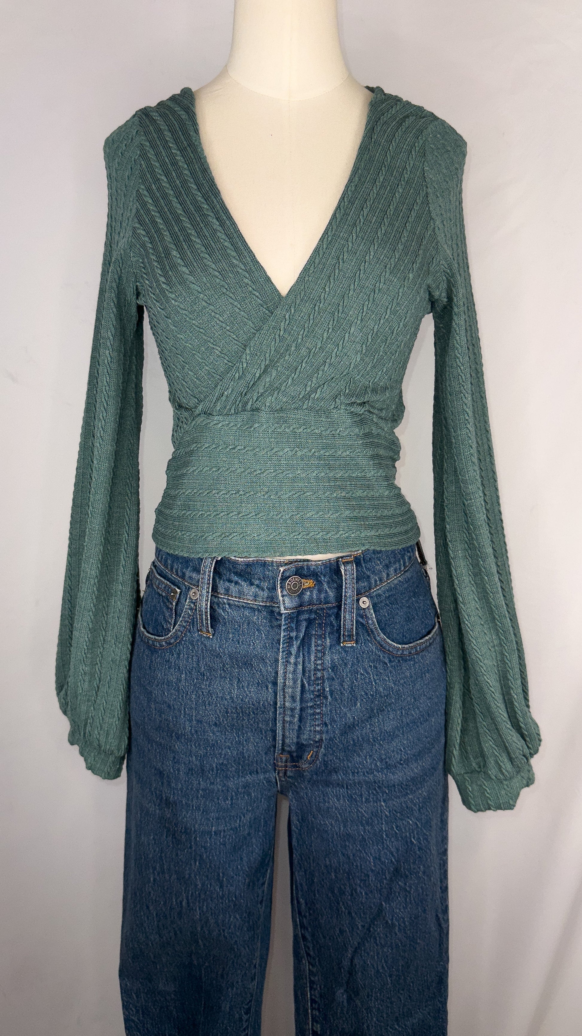 Front view of ZAFUL Ribbed Knit Cropped Wrap Top in Green. The top is shown being paired with a dark blue jean.